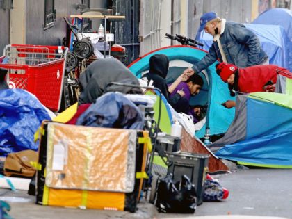 SAN FRANCISCO, CA - FEBRUARY 24: Homeless people consume illegal drugs in an encampment along Willow St. in the Tenderloin district of downtown on Thursday, Feb. 24, 2022 in San Francisco, CA. London Breed, mayor of San Francisco, is the 45th mayor of the City and County of San Francisco. …