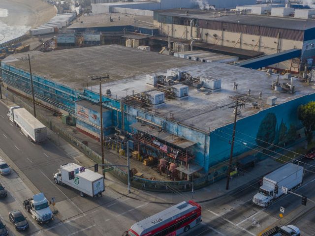 VERNON, CA - MAY 26: An aerial view shows the Farmer John slaughterhouse, near the Los Angeles River, after 153 workers tested positive for COVID-19, on May 26, 2020 in Vernon, California. Los Angeles County health officials are reporting coronavirus outbreaks at nine industrial facilities in the city of Vernon, …