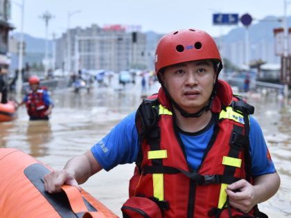 JIAN'OU, CHINA - JUNE 19: Rescuers use rubber boats to evacuate stranded people in flood water on June 19, 2022 in Jian'ou, Fujian Province of China. China's Fujian Province has evacuated nearly 220,000 people for heavy rain and rain-triggered floods starting early this month. (Photo by Huang Jiemin/VCG via Getty …