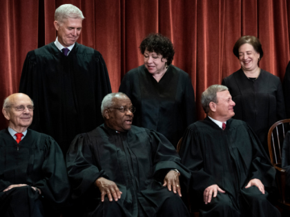 WASHINGTON, DC - NOVEMBER 30 : Justices of the United States Supreme Court sit for their official group photo at the Supreme Court on Friday, Nov. 30, 2018 in Washington, DC. Seated from left, Associate Justice Stephen Breyer, Associate Justice Clarence Thomas, Chief Justice of the United States John G. …