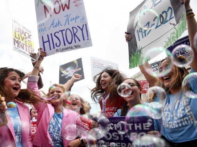 Anti-abortion campaigners celebrate outside the US Supreme Court in Washington, DC, on Jun