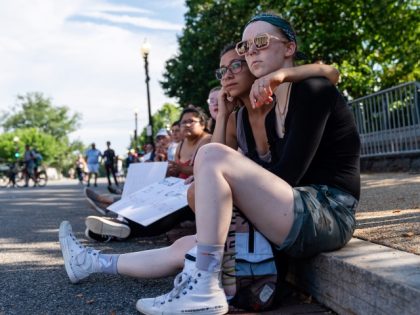 Abortion rights demonstrators embrace as they listen to speakers outside the Supreme Court in Washington, D.C., US, on Monday, June 27, 2022. A CBS News poll suggested that a majority of Americans disapprove of the Supreme Court's decision overturning the constitutional right to an abortion, which is inflaming a partisan …