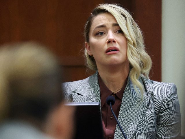 US actor Amber Heard testifies during the 50 million US dollar Depp vs Heard defamation trial at the Fairfax County Circuit Court in Fairfax, Virginia, on May 26, 2022. - Actor Johnny Depp is suing ex-wife Amber Heard for libel after she wrote an op-ed piece in The Washington Post …