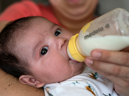 Two-month-old Jose Ismael Gálvez is fed a bottle of formula by his mother, Yury Navas, 29, of Laurel, Md., from her dwindling supply of formula at their apartment in Laurel, Md., Monday, May 23, 2022. After this day's feedings she will be down to their last 12.5 ounce container of …