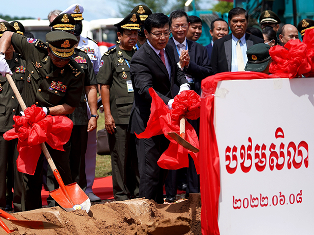 Cambodia's Defence Minister Tea Banh (L) and China's Ambassador to Cambodia Wang Wentian (