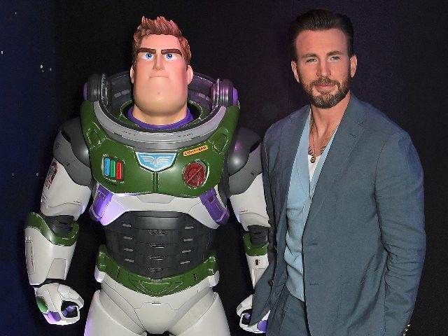 LONDON, ENGLAND - JUNE 13: Chris Evans (R) poses with Buzz Lightyear at the UK Premiere of "Lightyear" at Cineworld Leicester Square on June 13, 2022 in London, England. (Photo by David M. Benett/Dave Benett/WireImage)
