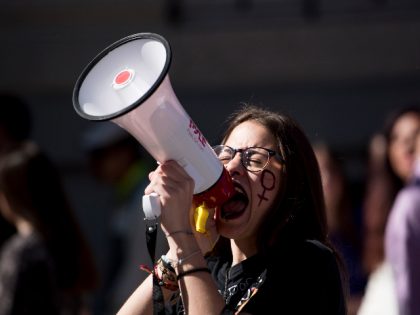 GRANADA, SPAIN - 2020/03/08: A protester shouts slogans on a megaphone during the march. I