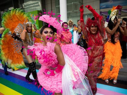 BANGKOK, THAILAND - JUNE 01: Thai drag queens from Stranger Bar dance during the 'Rainbow Runway for Equality' to kick off Pride Month at Central World Mall on June 01, 2022 in Bangkok, Thailand. Central Pattana Public Company Limited and the United Nations Development Programme held a "rainbow runway for …