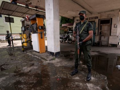 Sri Lankan army soldiers secure a deserted fuel station in Colombo, Sri Lanka, Sunday, June 5, 2022. The country is facing its worst economic crisis in recent memory. (AP Photo/Eranga Jayawardena)