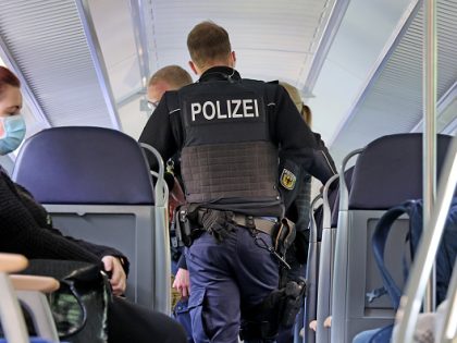 01 June 2022, Saxony-Anhalt, Magdeburg: Federal police officers walk through a Deutsche Bahn regional train. Today is the launch of the nine-euro public transport ticket. Photo: Peter Gercke/dpa-Zentralbild/dpa (Photo by Peter Gercke/picture alliance via Getty Images)