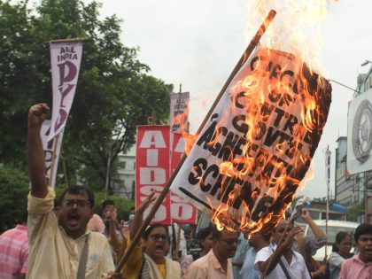 KOLKATA, INDIA JUNE 18: All India Democratic Students Organization (AIDSO) members burn placards and stage protest against Agnipath recruitment scheme for central defense forces on June 18, 2022 in Kolkata, India. The protests against the new defence recruitment scheme continues across the country. The violent protests which erupted in parts …