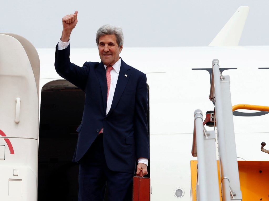 Secretary of State John Kerry waves as he boards his plane at Hanoi Airport on January 13, 2017. Kerry is in Vietnam to meet with top officials and deliver a speech on bilateral ties, his fourth and final trip to the communist nation where he served during the war. / AFP / POOL / Alex Brandon (Photo credit should read ALEX BRANDON/AFP via Getty Images)