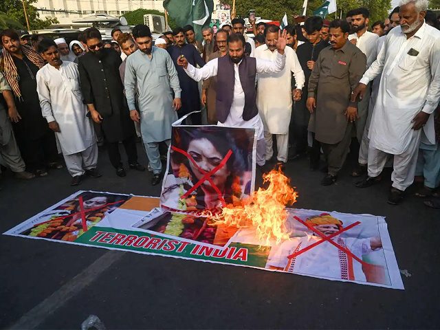 Protestors shout slogans and burn a picture of Nupur Sharma, the spokeswoman of India's Bh