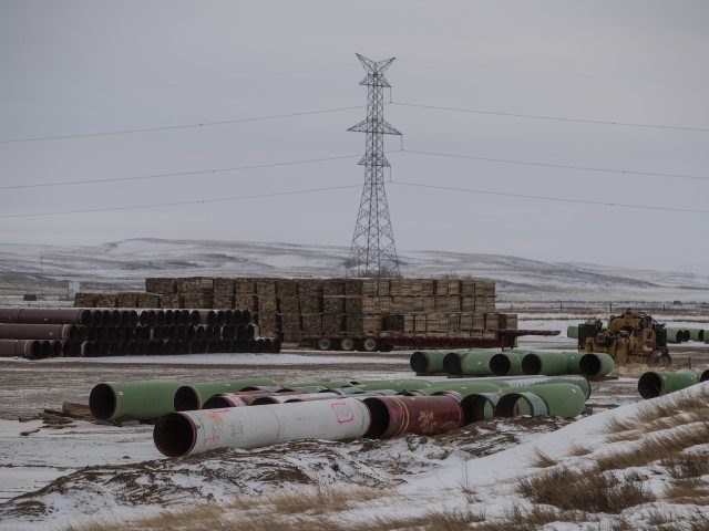 fossil fuels - Pipes for the Keystone XL pipeline stacked in a yard near Oyen, Alberta, Ca