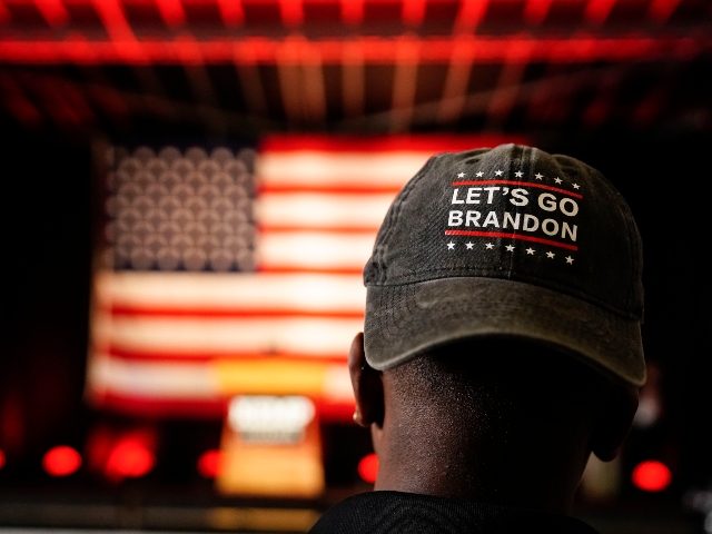 A person wears a "Let's Go Brandon" hat before Georgia Gov. Brian Kemp speaks during a Get Out the Vote Rally, on the eve of gubernatorial and other primaries in the state, on Monday, May 23, 2022, in Kennesaw, Ga. (AP Photo/Brynn Anderson)