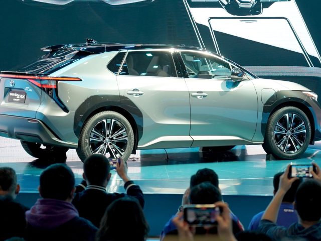 SHANGHAI, April 19, 2021 -- Journalists take photos of the Toyota bZ4X Concept, the first