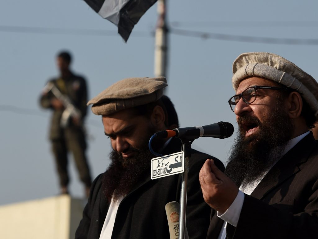 Abdul Rehman Makki, central leader Pakistan's Jamat ud Dawah addresses a protest against the printing of satirical sketches of the Prophet Muhammad by French magazine Charlie Hebdo, in Islamabad on January 16, 2015. At least three people were injured in clashes between anti-Charlie Hebdo protesters and police outside the French consulate in Pakistan's Karachi, officials said. The protest by the student wing of the Jamaat-e-Islami religious party was one of several that Islamist groups staged across the country after Friday prayers against the depiction of the Prophet Mohammed by the French satirical weekly. AFP PHOTO/Farooq NAEEM (Photo credit should read FAROOQ NAEEM/AFP via Getty Images)