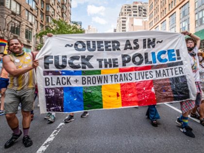 Participants seen marching behind a banner. Thousands of New Yorkers took to the streets of Manhattan to participate on the Reclaim Pride Coalition's third annual Queer Liberation March, where no police, politicians or corporations were allowed to participate. (Photo by Erik McGregor/LightRocket via Getty Images)