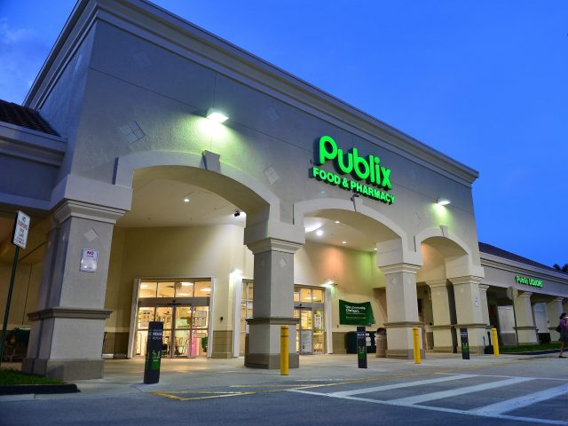 MIRAMAR, FLORIDA - JULY 16: Customers wearing face masks leave a Publix supermarket on Jul