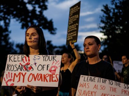 Abortion rights activists gather for a candle light vigil held in protest in front of the US Supreme Court in Washington, DC, on June 26, 2022, two days after the US Supreme Court scrapped half-century constitutional protections for the procedure - Elected leaders across the US political divide rallied on …