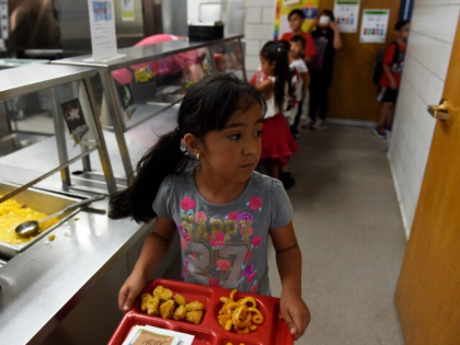 THORNTON, CO - JUNE 5: Sarah Carrasco, 7, takes her tray back to her seat during lunch at North Star Elementary School on June 5, 2017, in Thornton, Colorado. Adams 12 Five Star Schools offers free breakfast and/or lunch this summer at six schools to children ages one to 18 …
