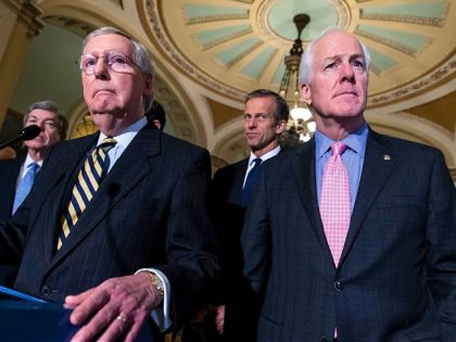 FILE - Sen. Mitch McConnell, R-Ky., left, and Sen. John Cornyn, R-Texas, right, talk to re