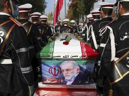FILE - In this photo released by the official website of the Iranian Defense Ministry, military personnel stand near the flag-draped coffin of Mohsen Fakhrizadeh, a scientist who was killed on Friday, during a funeral ceremony in Tehran, Iran, Monday, Nov. 30, 2020. A court in Iran on Thursday, June …