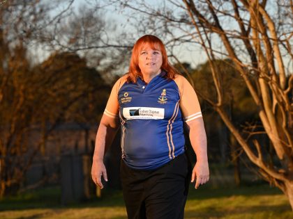 Transgender former rugby player Caroline Layt poses for pictures in her house backyard in Sydney on June 22, 2022. - The Australian decried rugby league's world governing body after it announced a ban on transgender players in international fixtures while it undertakes research to finalise a new policy in 2023. …