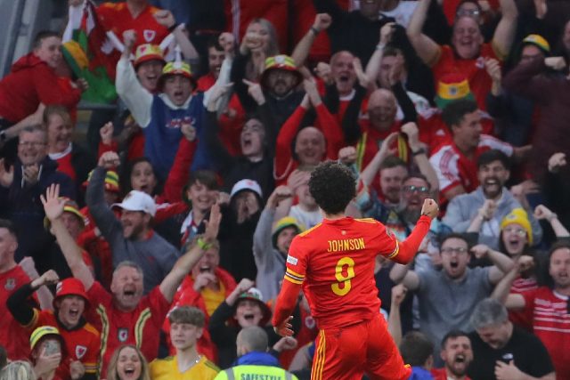 Brennan Johnson's first international goal salvaged a 1-1 draw for Wales against Belgium