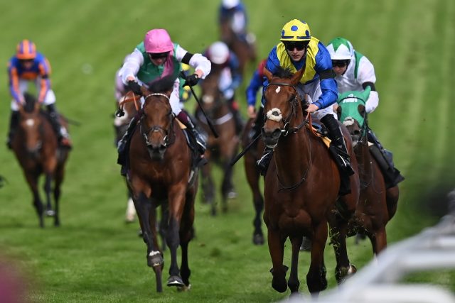 Desert Crown (right) winning the Epsom Derby