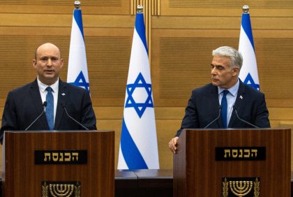 Israel's Prime Minister Naftali Bennett (L) and Foreign Minister Yair Lapid make a joint statement to the press in Jerusalem