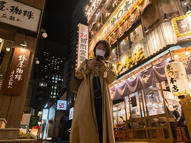 TOKYO, JAPAN - 2021/11/04: A woman wearing a face mask as a precaution against the spread