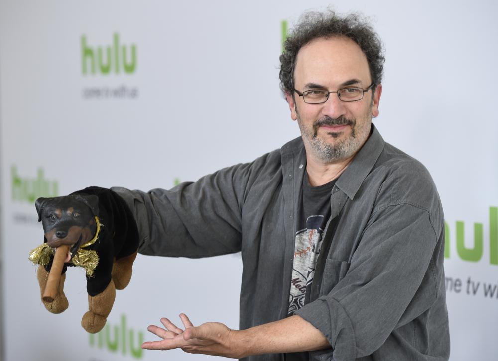 FILE - Robert Smigel, creator, executive producer and voice of "Triumph the Insult Comic Dog," poses with the puppet during the Television Critics Association 2016 Summer Press Tour at the Beverly Hilton on Aug. 5, 2016, in Beverly Hills, Calif. Federal prosecutors on Monday, July 18, 2022, declined to bring charges against Smigel and eight others associated with CBS’ “Late Show with Stephen Colbert” who were arrested in a building in the U.S. Capitol complex last month. (Photo by Chris Pizzello/Invision/AP, File)