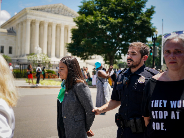Representative Alexandria Ocasio-Cortez, a Democrat from New York, is arrested outside the US Supreme Court during a protest of the court overturning Roe v. Wade in Washington, D.C., US, on Tuesday, July 19, 2022. The high court's reversal of the 1973 landmark decision protecting the federal right to abortion has …