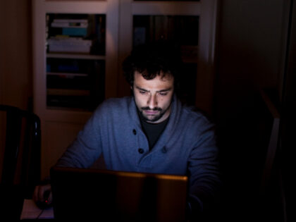 In this Feb. 17, 2012, photo, Santi Perez, 25, works on his computer at his parents home in Barcelona, Spain. Perez, an architecture student who lives with his parents, helped set up the internet blog called "The New Poor" that allows struggling young Spaniards to document their personal stories. Spain's …