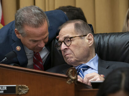 House Judiciary Committee Chairman Jerrold Nadler, D-N.Y., right, confers with Rep. David Cicilline, D-R.I., left, as the panel approves procedures for upcoming impeachment investigation hearings on President Donald Trump, on Capitol Hill in Washington, Thursday, Sept. 12, 2019. (AP Photo/J. Scott Applewhite)