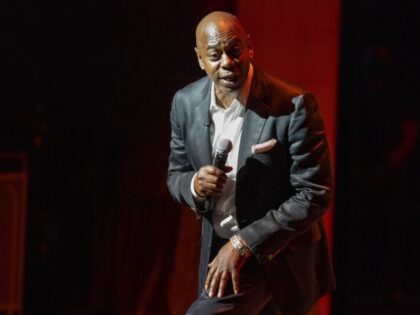 Dave Chappelle performs during a theater dedication ceremony honoring the comedian and actor, and to raise funds to support Duke Ellington School of the Arts in Washington, Monday, June. 20, 2022. (AP Photo/Gemunu Amarasinghe)