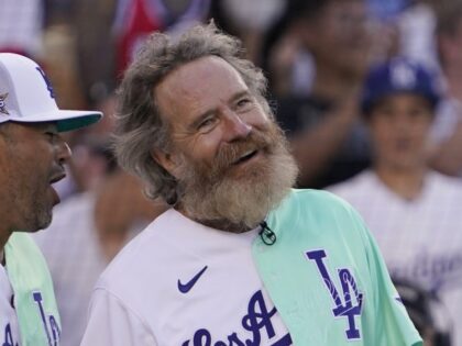 Actor Bryan Cranston smiles after catching a foul ball during the MLB All Star Celebrity Softball game, Saturday, July 16, 2022, in Los Angeles. (AP Photo/Mark J. Terrill)