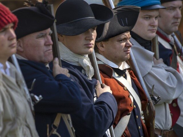 : The Blue Coats gather during a reenactment of the American Revolution in Huntington Beac