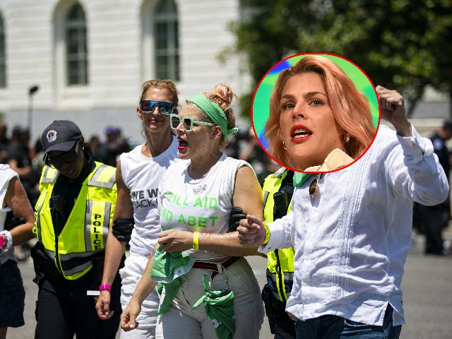 Actress Busy Philipps, center, is detained by US Capitol Police for blocking an intersection with abortion rights demonstrators during a protest near the US Supreme Court in Washington, D.C., US, on Thursday, June 30, 2022. President Biden today said he would support changing the Senate's filibuster rules to pass legislation …
