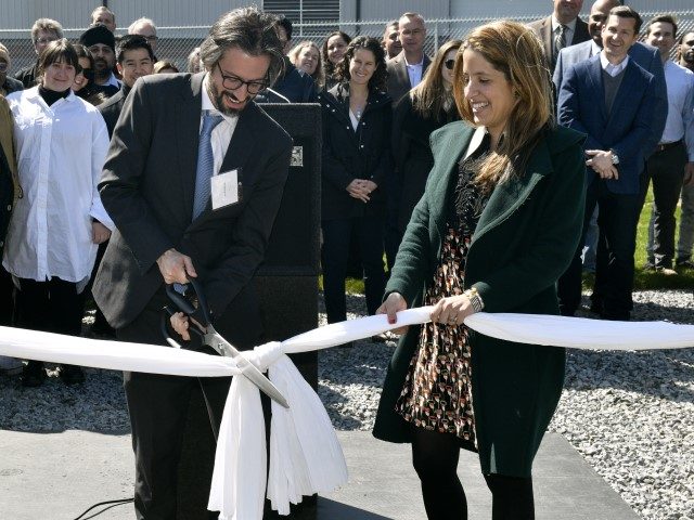 Ron Belldegrun, Mia Funt and the ByHeart team cut the ceremonial ribbon during the ByHeart infant formula facility ribbon cutting on April 28, 2022, in Reading, Pennsylvania. (Eugene Gologursky/Getty Images for ByHeart)