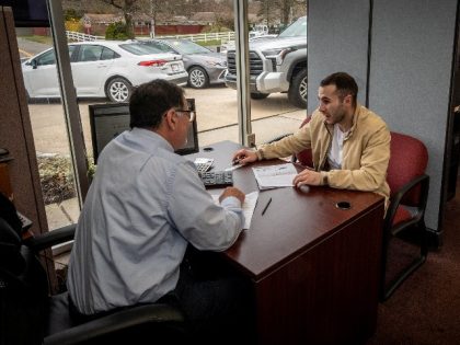 Shaun O'Connell talking with new car sales David Moshinsky at Smithtown Toyota in Smithtown, New York on April 19, 2022. (Photo by J. Conrad Williams Jr./Newsday RM via Getty Images)