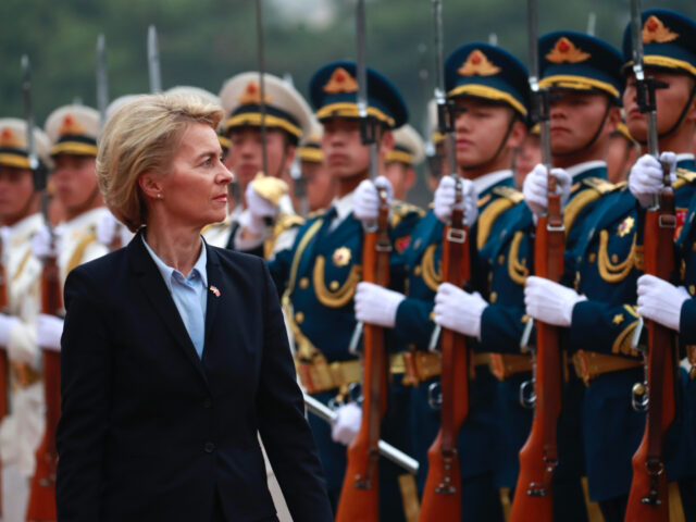 German Defense Minister Ursula von der Leyen (C) and China's Minister of National Defense General Wei Fenghe (not pictured) review honour guards during a military honours ceremony at the Bayi building in Beijing on October 22, 2018. (Photo by HOW HWEE YOUNG / POOL / AFP) (Photo credit should read …