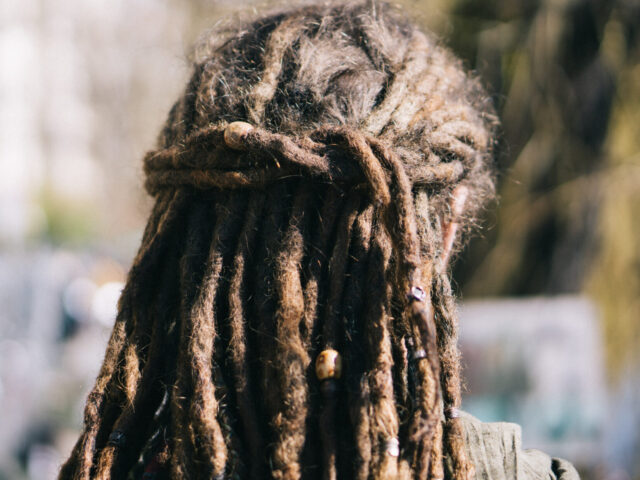 Rear View Of Woman With Dreadlocks