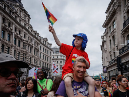 OXFORD CIRCUS, LONDON, ENGLAND, UNITED KINGDOM - 2019/07/06: A kid on top of the father's shoulders