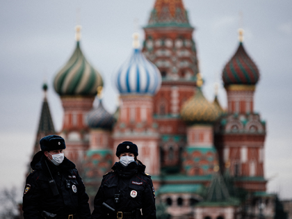 Russian police officers patrol on March 30, 2020 on the deserted Red square in front of Saint Basil's Cathedral in Moscow as the city and its surrounding regions imposed lockdowns today, that were being followed by other Russian regions in a bid to slow the spread of the COVID-19 infection …
