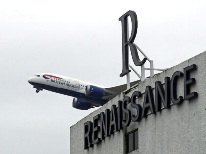A plane flies over the Renaissance Hotel near Heathrow Airport, London. From Monday UK nationals or residents returning to England from 33 "red list" countries will be required to spend 10 days in a Government-designated quarantine hotel upon arrival. Picture date: Sunday February 14, 2021. (Photo by Steve Parsons/PA Images …