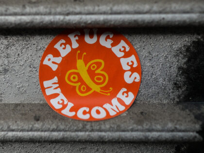 A sticker 'Refugees Welcome' seen on a fence in Dublin center during Level 5 Cov