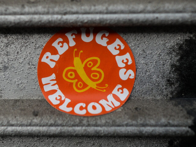 A sticker 'Refugees Welcome' seen on a fence in Dublin center during Level 5 Covid-19 lockdown. On Wednesday, February 24, 2021, in Dublin, Ireland. (Photo by Artur Widak/NurPhoto via Getty Images)