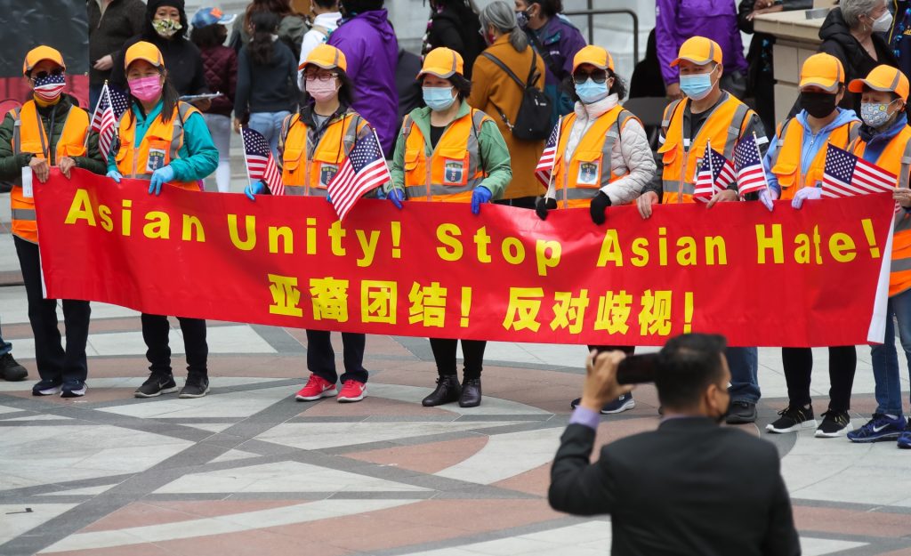 People holding a bilingual banner take part in a Stop Asian Hate rally in Oakland, San Francisco Bay Area, the United States, May 15, 2021. (Photo by Dong Xudong/Xinhua via Getty Images) (Xinhua/Dong Xudong via Getty Images)